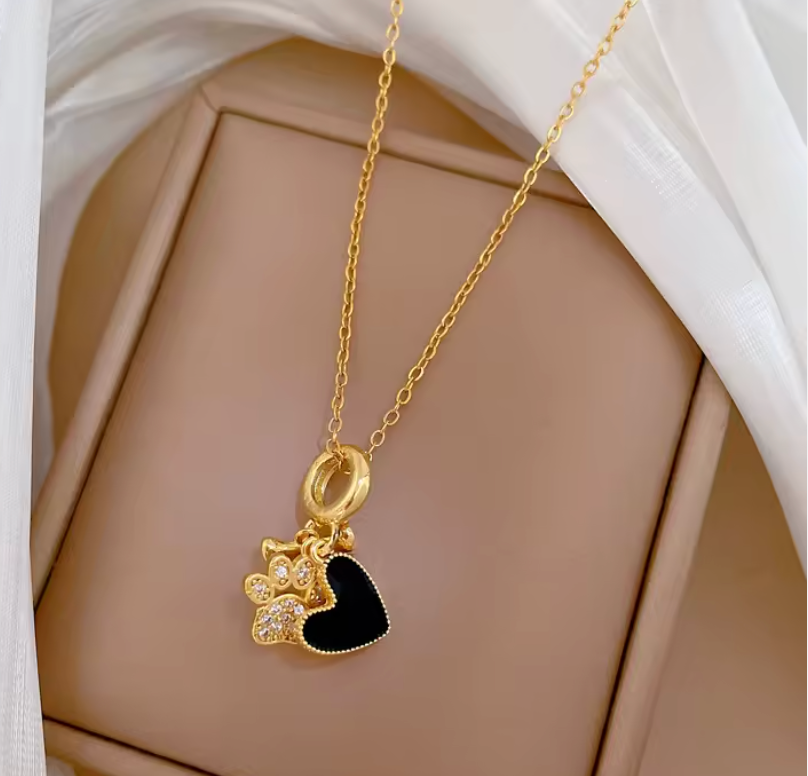Gold puppy paw and heart charm necklace