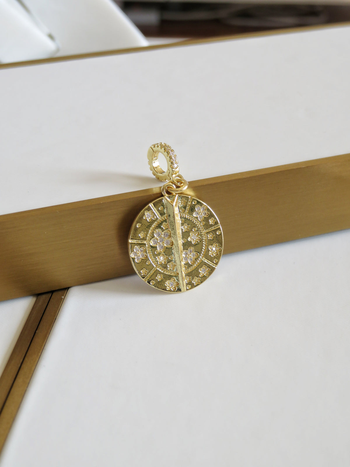 Blossoms with Thorn Sundial Charm on Diamond Hinged Clasp