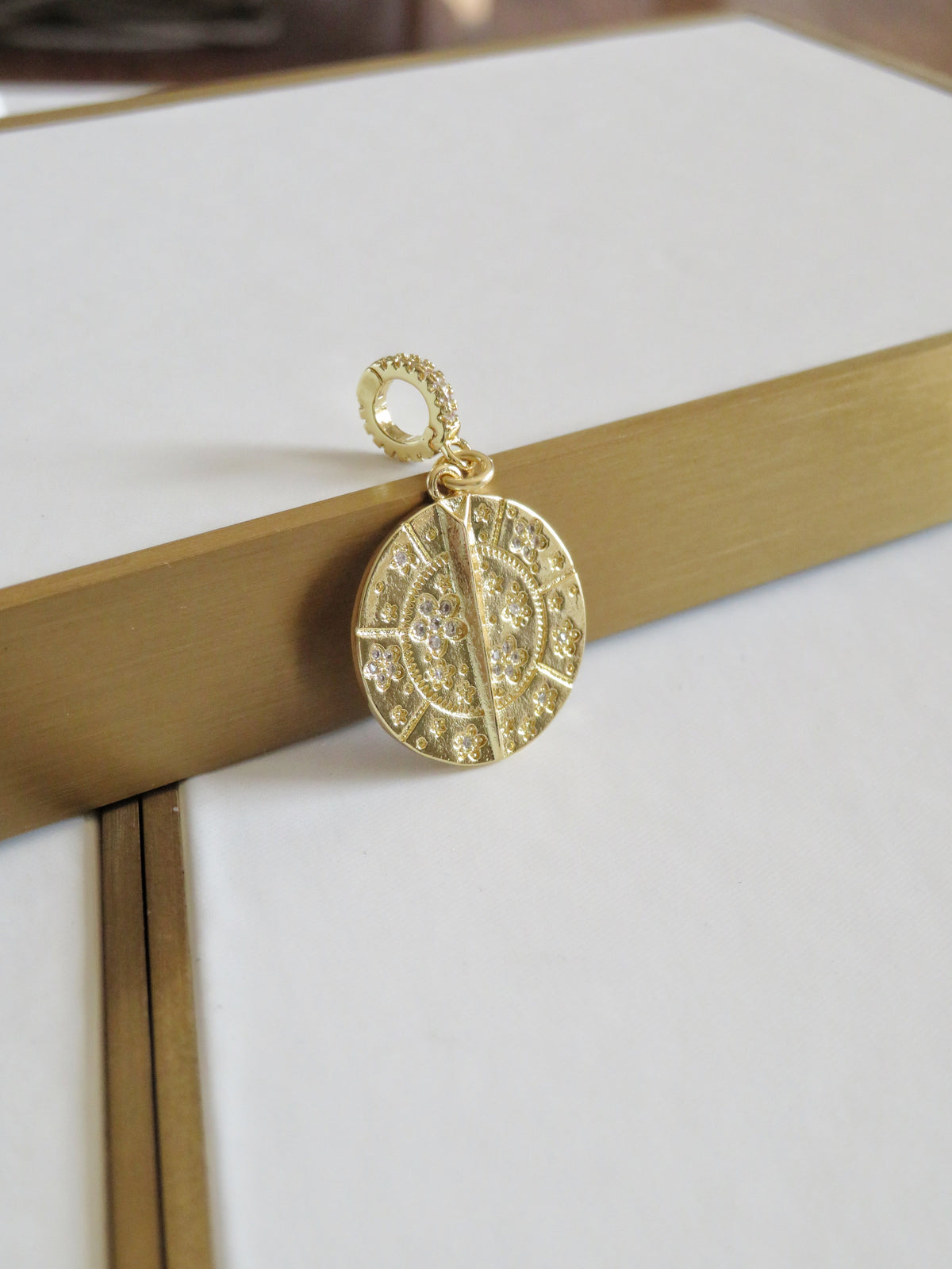 Blossoms with Thorn Sundial Charm on Diamond Hinged Clasp